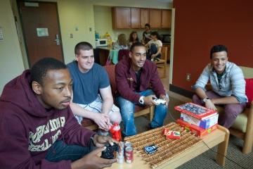 Students playing video games in residence hall